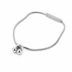 Side view of 925 silver box chain bolo bracelet with pavé cubic zirconia bar and adjustable slider balls
