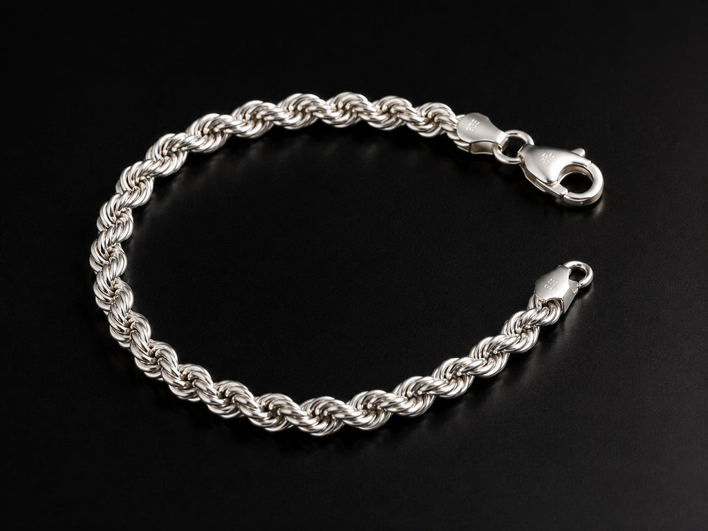 A silver twisted rope chain bracelet with a lobster clasp, displayed on a dark black background.