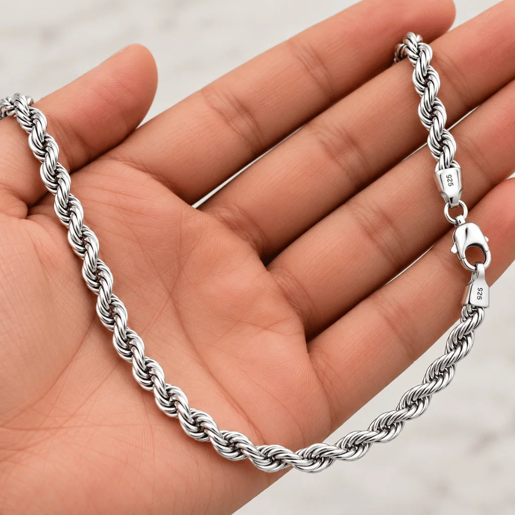 Twisted 925 sterling silver rope chain shown in hand for scale