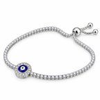 Side view of 925 sterling silver round evil eye bracelet with blue enamel center and slider ball ends