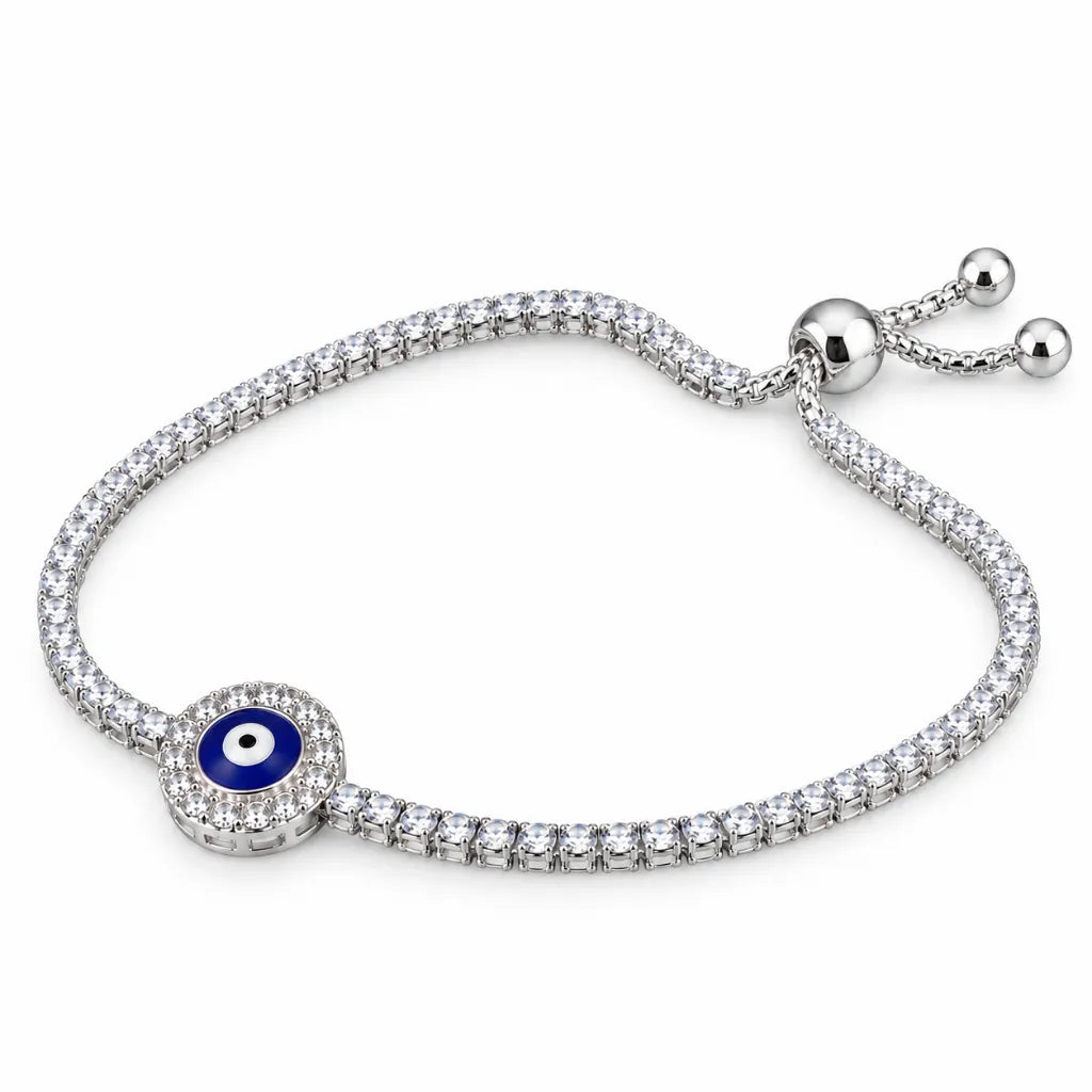 Side view of 925 sterling silver round evil eye bracelet with blue enamel center and slider ball ends