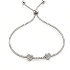Adjustable heart tennis bracelet with sparkling cubic zirconia band and bolo slider ball ends, top view