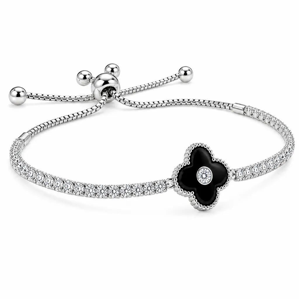 Adjustable sterling silver tennis bracelet with black clover charm and bolo slider ball ends