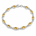 Silver citrine link bracelet with twelve oval bezel-set golden yellow gemstones and lobster clasp