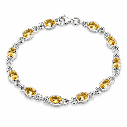 Silver citrine link bracelet with twelve oval bezel-set golden yellow gemstones and lobster clasp