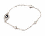 Close-up of sterling silver evil eye bracelet featuring blue evil eye charm and zircon stones