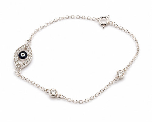 Close-up of sterling silver evil eye bracelet featuring blue evil eye charm and zircon stones