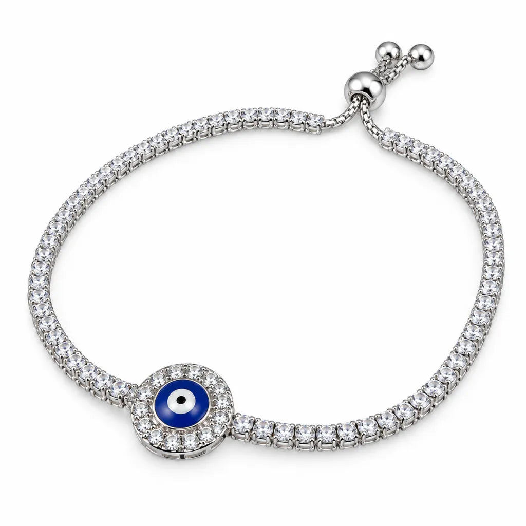 Sterling silver evil eye tennis bracelet with navy blue enamel eye, cubic zirconia halo and adjustable slider clasp