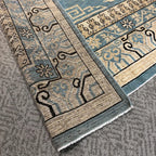 Handmade blue and beige wool rug for traditional home decor