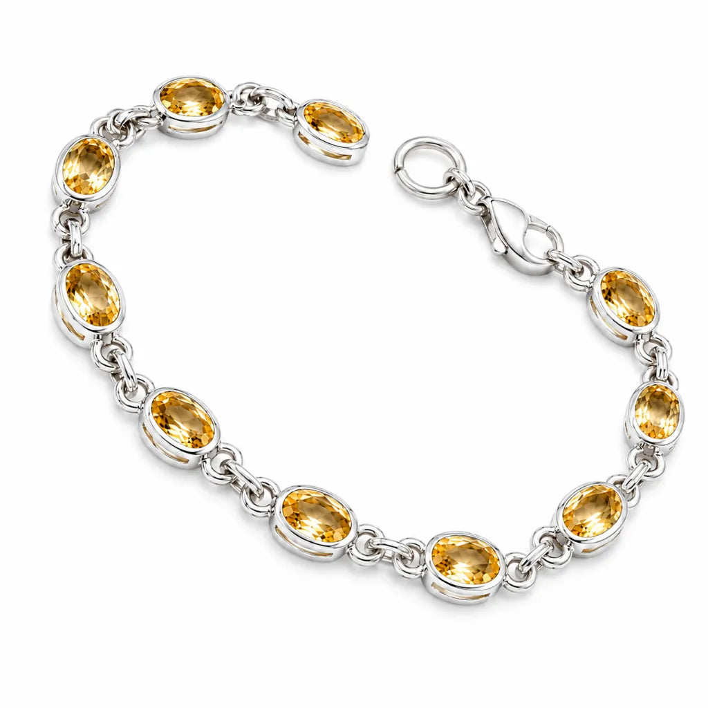 November birthstone citrine bracelet in silver with oval yellow gemstones, shown open with lobster clasp and spring ring