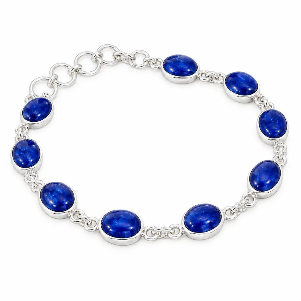 Sterling silver bezel-set bracelet with oval blue gemstones and adjustable ring extender, perfect September birthstone gift