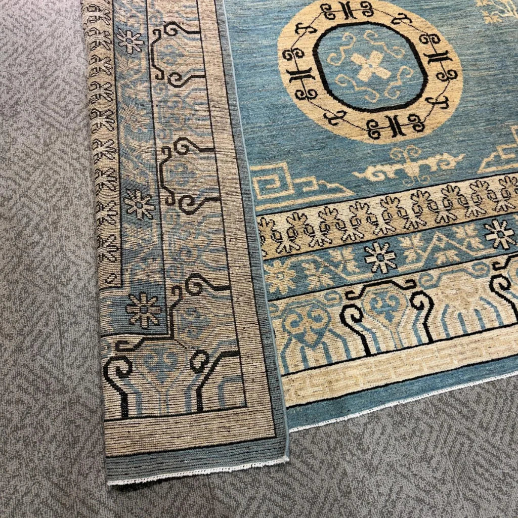 Traditional Khotan style area rug with wool and medallion design