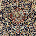 Close-up detail of intricate floral medallion pattern on vintage Tabriz-style Persian rug