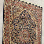 Full view of vintage Tabriz-style Persian area rug measuring 4 feet 7 inches by 6 feet 7 inches