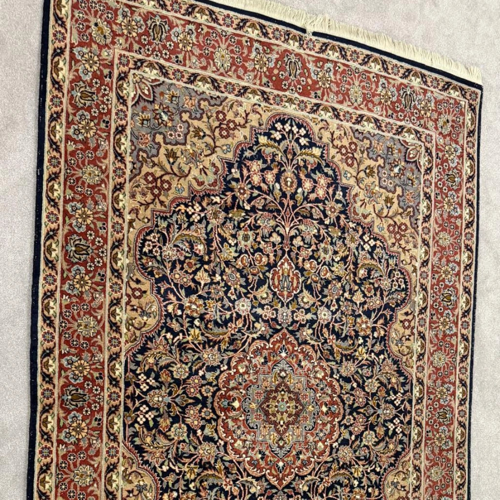 Full view of vintage Tabriz-style Persian area rug measuring 4 feet 7 inches by 6 feet 7 inches
