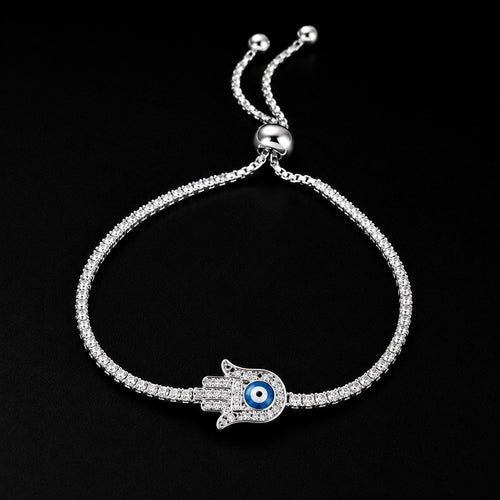 Women's sterling silver Hamsa evil eye bracelet worn on wrist